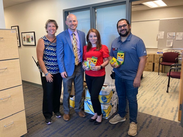 Mr. Gessel and Ms. Garman accepting donations from Giant Store Manager Cynthia Kirol and Assistant Store Manager Evan Oliveri