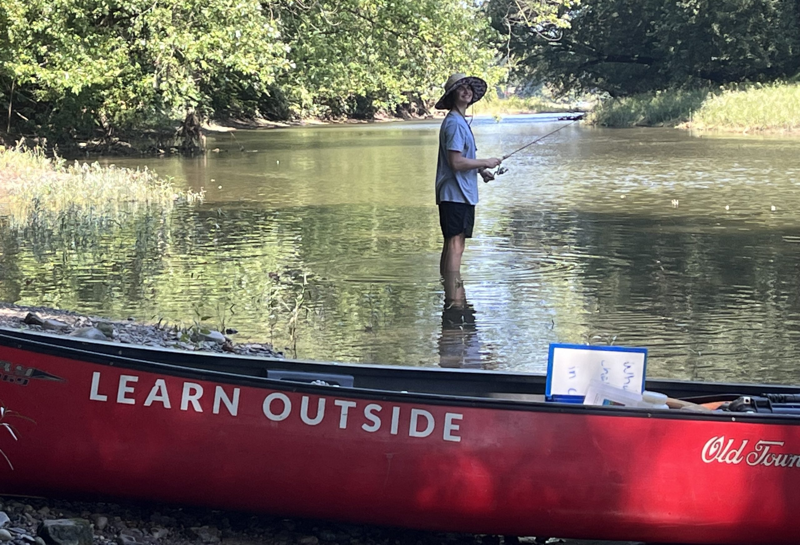 Nevin Wolfe fishing for data on the Susquehanna River as part of the Environmental Science Class