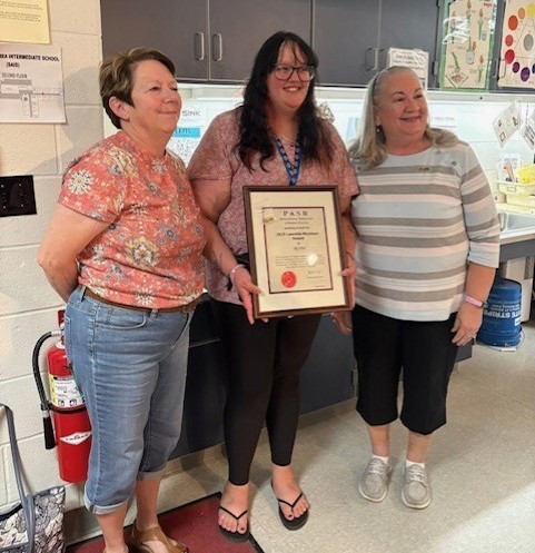 The Lauretta Woodson Award was presented to Sky Weir at the IS for her exemplary commitment to the learning process and growth of children. Congratulations Sky.